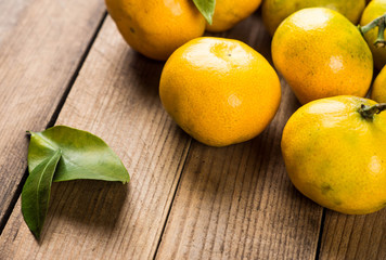 Tangerines on wooden table
