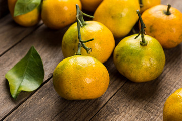 Tangerines on wooden table