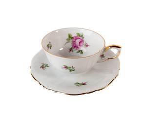 Porcelain teacup and saucer with rose in classic style