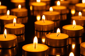 Many burning candles with shallow depth of field
