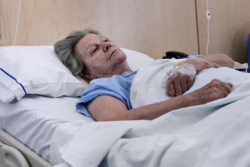 Women, the elderly, in a hospital bed