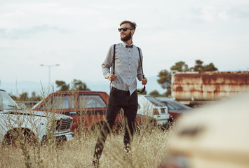 Young handsome stylish man, wearing shirt and bow-tie on the fie