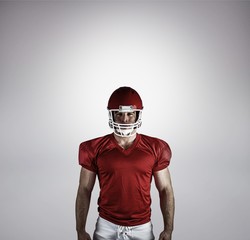 Composite image of american football player looking at camera