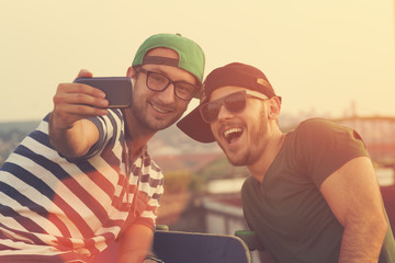 Couple of guys doing a selfie.