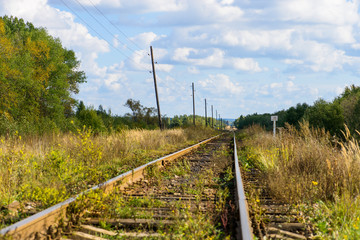 Autumn Industrial landscape, railway receding into the distance