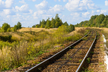 Fototapeta na wymiar Autumn Industrial landscape, railway receding into the distance