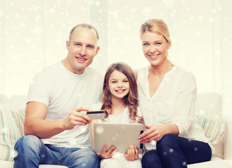 happy family with tablet pc and credit card