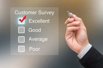Hand clicking customer survey on virtual screen