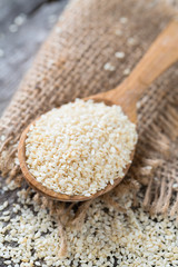 sesame seeds on wooden surface