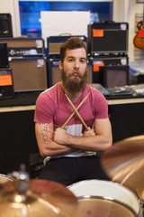 male musician with cymbals at music store