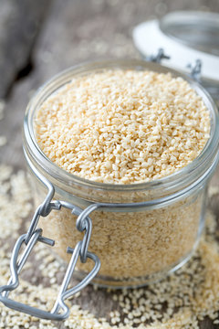 sesame seeds on wooden surface