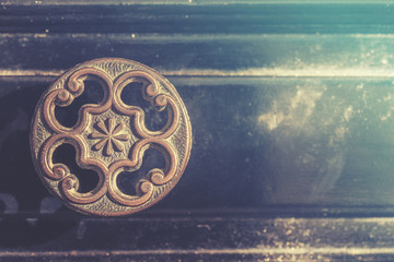 Old drawer handle. Cross processed image for vintage look