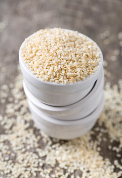 sesame seeds on wooden surface