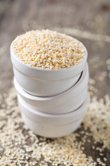 sesame seeds on wooden surface