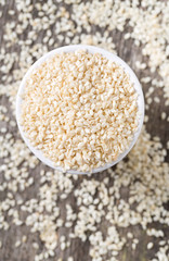 sesame seeds on wooden surface