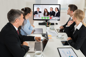 Businesspeople Watching An Online Presentation