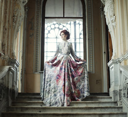 Naklejka premium woman standing on the top of a stairway 