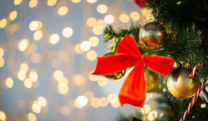close up of red bow decoration on christmas tree