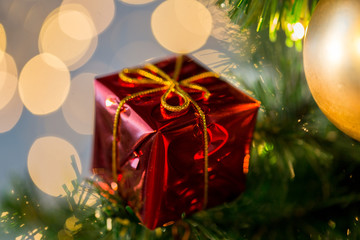 close up of gift box decoration on christmas tree
