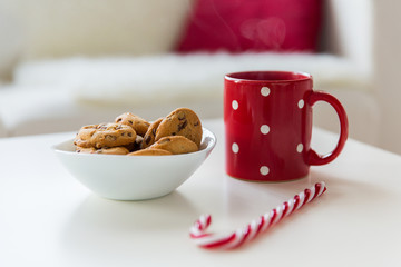 close up of oat cookies, sugar cane candy and cup