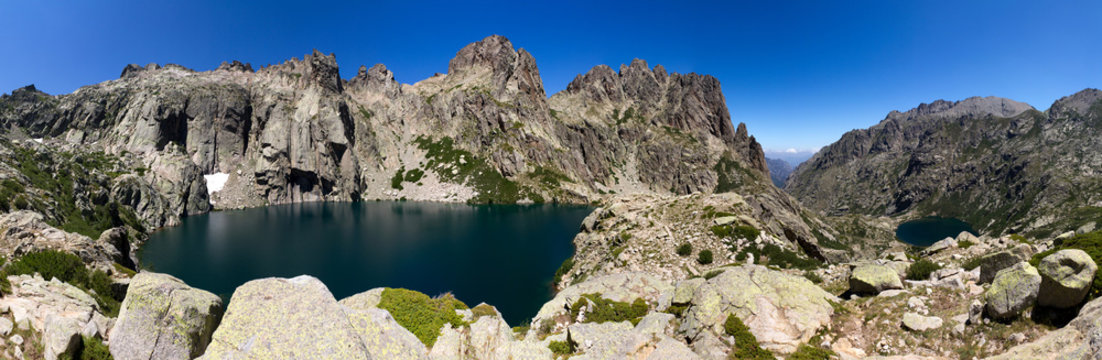 Large panorama of two mountain lakes in Corsica named 'Les gorges de la Restonica'