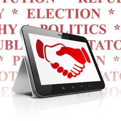 Political concept: Tablet Computer with Handshake on display