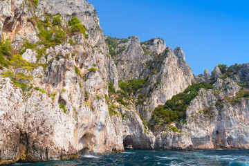 Fototapeta na wymiar Touristic motorboat enters the grotto of Capri