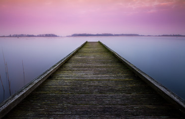 Serene color image of a jetty in a lake 