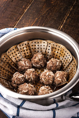 Meatball in the steamer on the wooden table vertical