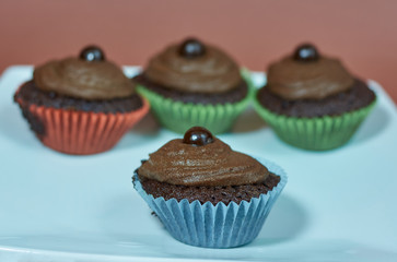 Dessert cookies muffins with cream and chocolate.