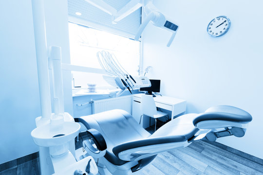 Dentist's office. Dental equipment, modern, clean interior. Blue tone