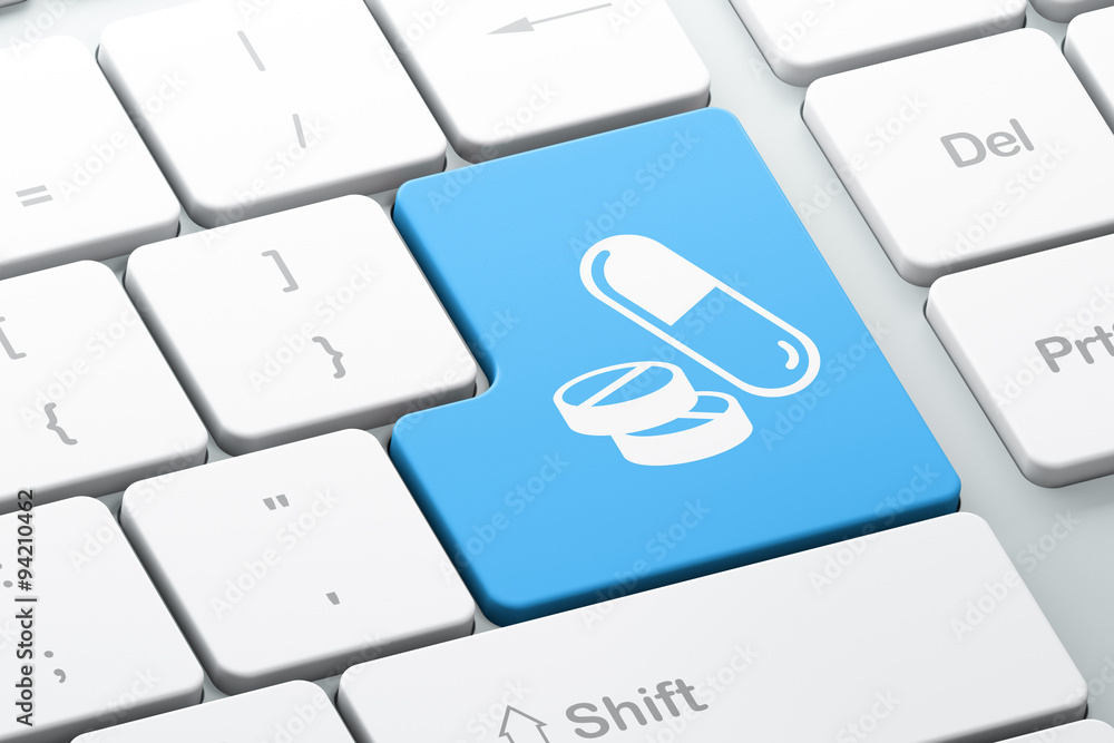 Poster healthcare concept: pills on computer keyboard background