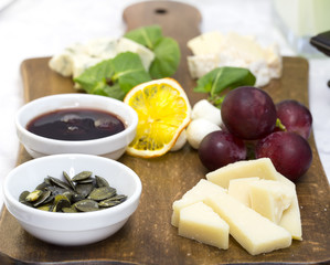 cheese plate with a large decorated the assortment of mint