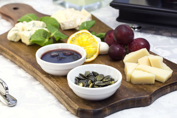 cheese plate with a large decorated the assortment of mint