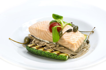Baked salmon fillet with vegetables in a restaurant
