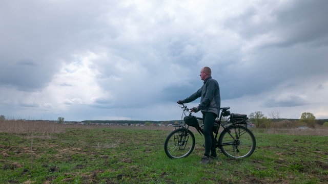  Adult man  cyclist against clouds. 4K (4096x2304)   Time lapse without bird