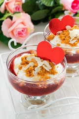 dessert with berry jam and cream for Valentine's Day, vertical