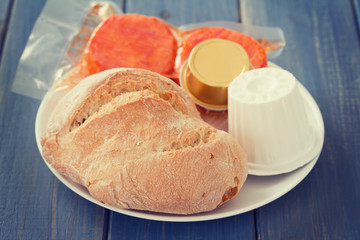 bread with cheese and pate on white plate