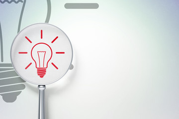 Finance concept:  Light Bulb with optical glass on digital