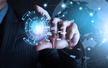 businessman hold business world