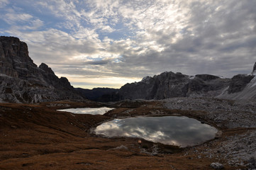 Dolomites  / The Dolomites  are a mountain range located in northeastern Italy. They form a part of the Southern Limestone Alps and extend from the River Adige to the Piave Valley.