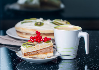 piece of cake with butter cream and berries