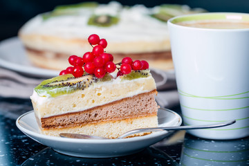 piece of cake with butter cream and berries