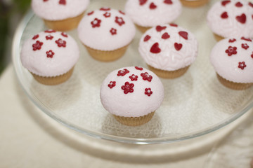 White cakes with red stars on the table