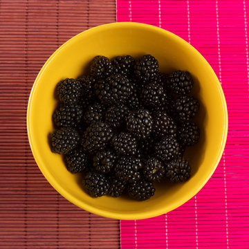 Fresh Blackberries In A Yellow Bowl