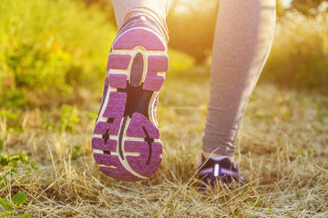 Woman running in a field