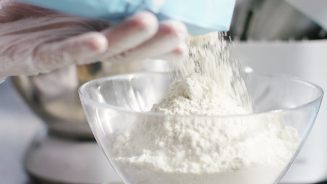 4K Flour being poured into a clear bowl