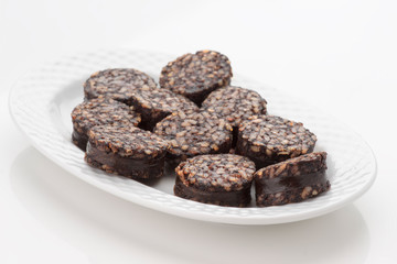 Iberian homemade sausage on white tray