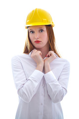 Long haired happy girl with yellow helmet looking to us