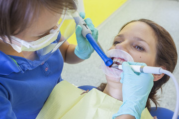 Female patient during installation of rubber dam